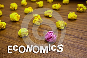 Conceptual hand writing showing Economics. Business photo showcasing branch of knowledge concerned with production