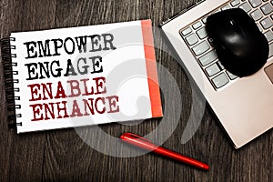 Conceptual hand writing showing Empower Engage Enable Enhance. Business photo showcasing Empowerment Leadership Motivation Engagem