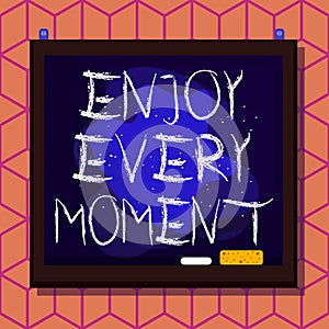 Conceptual hand writing showing Enjoy Every Moment. Business photo text being pleased with your life Have fun Precious