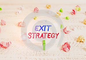 Conceptual hand writing showing Exit Strategy. Business photo text Extricating oneself from a situation that is become difficult photo