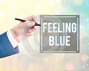 Conceptual hand writing showing Feeling Blue. Business photo text Feeling of desperation because of sadness or missing someone