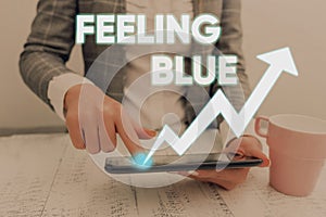 Conceptual hand writing showing Feeling Blue. Business photo text Feeling of desperation because of sadness or missing someone