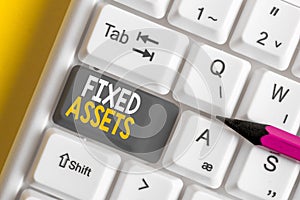 Conceptual hand writing showing Fixed Assets. Business photo showcasing longterm tangible piece of property or equipment