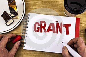 Conceptual hand writing showing Grant. Business photo showcasing Money given by an organization or government for a purpose Schola