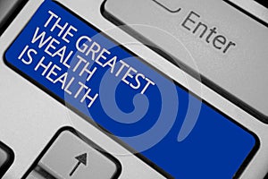 Conceptual hand writing showing The Greatest Wealth Is Health. Business photo text being in good health is the prize Take care Key