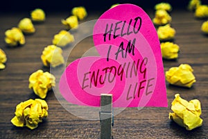 Conceptual hand writing showing Hello I Am Enjoying Life. Business photo text Happy relaxed lifestyle Enjoy simple things Papercli