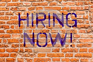 Conceptual hand writing showing Hiring Now. Business photo showcasing Workforce Wanted New Employees Recruitment Brick Wall art