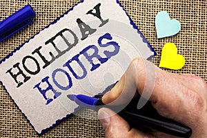 Conceptual hand writing showing Holiday Hours. Business photo showcasing Celebration Time Seasonal Midnight Sales Extra-Time Openi