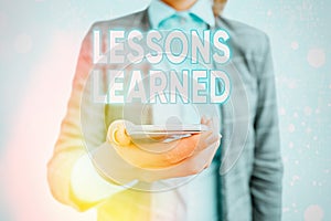 Conceptual hand writing showing Lessons Learned. Business photo showcasing Promote share and use knowledge derived from experience