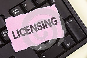 Conceptual hand writing showing Licensing. Business photo showcasing Grant a license Legally permit the use of something Allow act