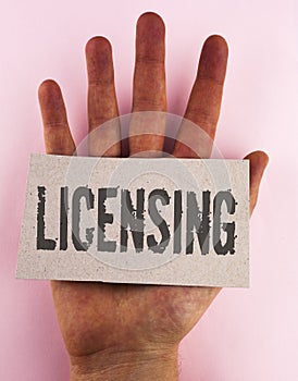 Conceptual hand writing showing Licensing. Business photo text Grant a license Legally permit the use of something Allow activity
