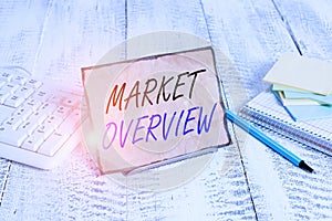 Conceptual hand writing showing Market Overview. Business photo text brief synopsis of a commercial or industrial market Notepaper
