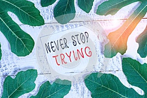 Conceptual hand writing showing Never Stop Trying. Business photo showcasing Do not give up Continue to Try Again Keep