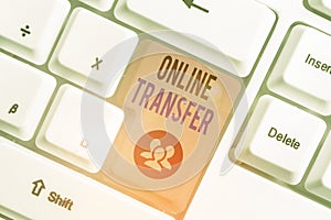 Conceptual hand writing showing Online Transfer. Business photo showcasing authorizes a fund transfer over an electronic funds photo