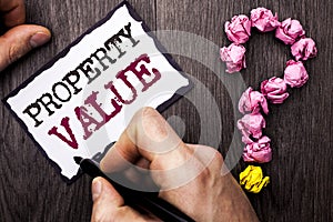 Conceptual hand writing showing Property Value. Business photo text Estimate of Worth Real Estate Residential Valuation written by