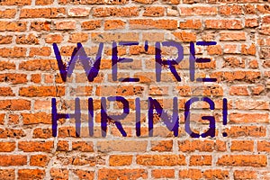 Conceptual hand writing showing We Re Hiring. Business photo showcasing Workforce Wanted New Employees Recruitment Brick Wall art