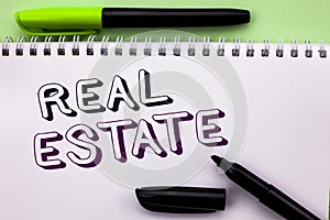 Conceptual hand writing showing Real Estate. Business photo showcasing Residential Property Building Covered Land Chattels Real wr