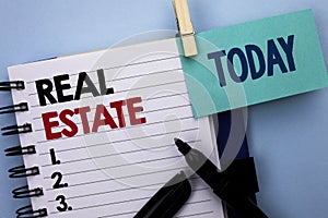 Conceptual hand writing showing Real Estate. Business photo text Residential Property Building Covered Land Chattels Real written