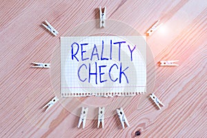 Conceptual hand writing showing Reality Check. Business photo showcasing one is reminded of the state of things in the real world