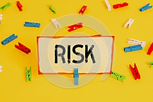 Conceptual hand writing showing Risk. Business photo text Possibility of losing something of value or threat of damage Colored