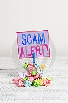 Conceptual hand writing showing Scam Alert. Business photo text fraudulently obtain money from victim by persuading him
