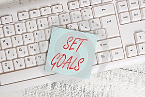 Conceptual hand writing showing Set Goals. Business photo showcasing Defining or achieving something in the future based