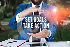 Conceptual hand writing showing Set Goals Take Action. Business photo showcasing Act on a specific and clearly laid out