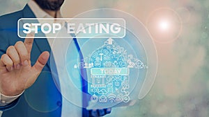 Conceptual hand writing showing Stop Eating. Business photo text cease the activity of putting or taking food into the mouth