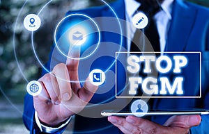 Conceptual hand writing showing Stop Fgm. Business photo text Put an end or stop on genital cutting and circumcision. photo