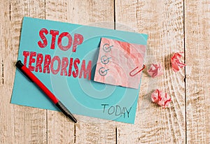 Conceptual hand writing showing Stop Terrorism. Business photo showcasing Resolving the outstanding issues related to violence