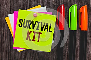 Conceptual hand writing showing Survival Kit. Business photo showcasing Emergency Equipment Collection of items to help someone Pa