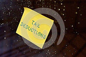 Conceptual hand writing showing Tax Deductions. Business photo text an amount or cost that subtracted from someone s is