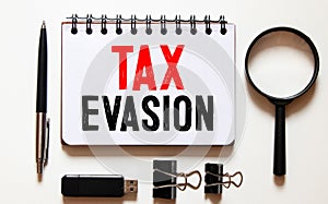 Conceptual hand writing showing Tax Evasion