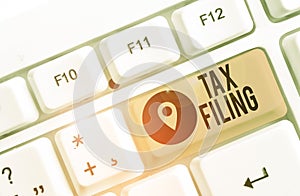 Conceptual hand writing showing Tax Filing. Business photo showcasing Submitting documens filed with tax payer financial