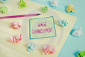 Conceptual hand writing showing Wage Garnishment. Business photo showcasing Deducting money from compensation ordered by the court photo