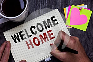 Conceptual hand writing showing Welcome Home. Business photo text Expression Greetings New Owners Domicile Doormat Entry Man holdi photo