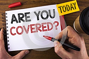 Conceptual hand writing showing Are You Covered Question. Business photo text Health insurance coverage disaster recovery written