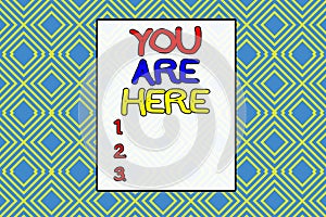 Conceptual hand writing showing You Are Here. Business photo text This is your location reference point global