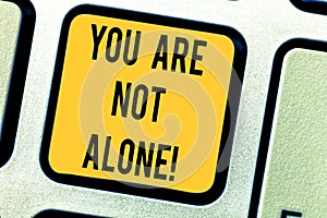Conceptual hand writing showing You Are Not Alone. Business photo text Offering help support assistance collaboration