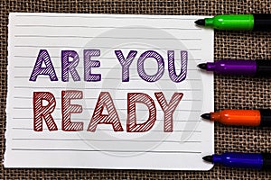 Conceptual hand writing showing Are You Ready. Business photo showcasing Alertness Preparedness Urgency Game Start Hurry Wide awak