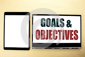 Conceptual hand writing text caption inspiration showing Goals Objectives. Business concept for Plan Success Vision written on tab