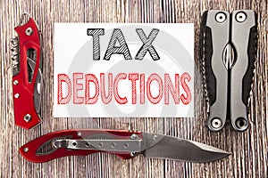 Conceptual hand writing text caption inspiration showing Tax Deductions. Business concept for Finance Incoming Tax Money Deduction