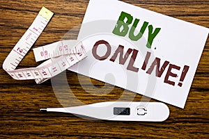 Conceptual hand writing text caption showing Buy Online. Business concept for E-commerce Sale Purchase written on sticky note pape