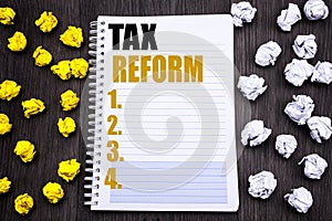 Conceptual hand writing text caption showing Tax Reform. Business concept for Government Change in Taxes Written on notepad note n