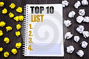 Conceptual hand writing text caption showing Top 10 Ten List. Business concept for Success ten list Written on notepad note notebo