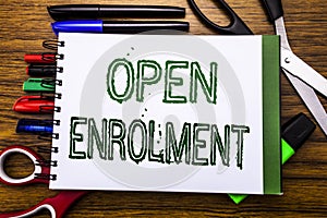 Conceptual hand writing text Open Enrolment. Concept for Medicine Doctor Enroll Written on notebook, wooden background with offic