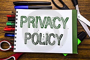 Conceptual hand writing text Privacy Policy. Concept for Safety Data Rules Written on notebook, wooden background with office equ