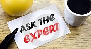 Conceptual hand writing text showing Ask The Expert. Business concept for Advice Help Question written sticky note empty paper, Wo
