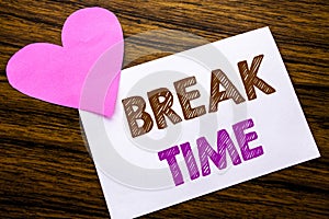 Conceptual hand writing text showing Break Time. Concept for Stop Pause From Work Workshop written on sticky note paper, wooden wo