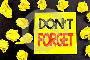 Conceptual hand writing text showing Do Not Forget. Business concept for Don t memory Remider written on sticky note paper. Folded photo